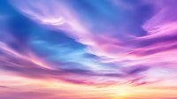 Dramatic sunset sky with vibrant purple, pink and blue clouds swirling in ethereal patterns against golden horizon, creating atmospheric celestial backdrop.