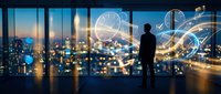 Businessman silhouette overlooking city skyline with glowing digital network connections and data visualization graphics at sunset through office windows.