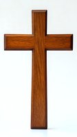 Wooden cross with rich brown wood grain texture isolated on white background, suitable for religious and spiritual design projects.