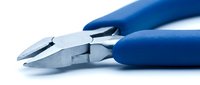 Dental pliers with blue handles isolated on white background, ready for orthodontic treatment and dental procedures.