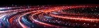 Abstract red and blue light trails forming curved lines against dark background with glowing particles creating dynamic motion effect for technology concepts.
