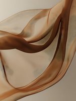 Flowing brown silk fabric creates elegant waves and curves against neutral background, showcasing smooth textile movement and luxurious satin texture.
