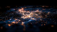 Glowing orange and blue particles form abstract wave pattern against dark background, creating futuristic network visualization effect. Suitable for technology concepts.