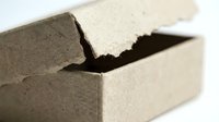 Cracked concrete block showing structural damage and material failure on white background isolated for construction industry presentations.