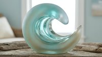 Turquoise glass wave sculpture on driftwood, coastal home decor accent with shimmering ocean-inspired art piece for interior design.