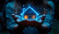 Cupped hands holding glowing house with warm windows surrounded by magical blue sparkles and stardust against dark background for real estate dreams.