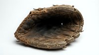 Vintage worn leather baseball glove with weathered brown texture and classic mitt design for sports and recreation themes.