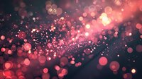 Magical pink and coral bokeh lights scattered on dark background create dreamy atmosphere with glowing particles and blurred circles for romantic design projects.