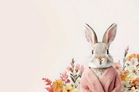 Charming bunny wearing cozy pink sweater surrounded by delicate spring flowers and botanical elements on soft pink background, creating whimsical spring mood.