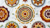 Decorative autumn mandala collection with intricate floral patterns in warm orange, red and yellow colors on white background for seasonal design projects.
