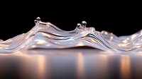 Elegant liquid wave formation with water drops and ripples against dark background, illuminated with soft warm light creating reflective surface effect.