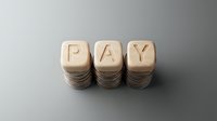 Wooden blocks stacked with letters spelling PAY on neutral background, representing payment, salary, wages, compensation, financial transaction, business concept for commerce and money exchange.