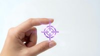 Hand holding transparent glass cube with purple crosshair target symbol inside, representing precision, focus and strategic planning for business presentations.