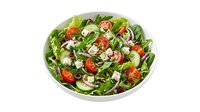 Fresh garden salad with mixed greens, tomatoes, cucumbers, and white cheese crumbles in a white bowl, suitable for healthy eating and nutrition content.