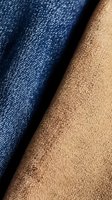 Close-up macro shot of blue denim and beige fabric textures showing detailed weave patterns and contrasting colors for fashion and textile design projects.