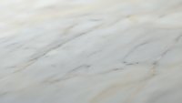 White marble surface with natural gray veining patterns for luxury interior design and architectural backgrounds.