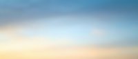 Soft gradient sky background with blue and peach tones blending seamlessly for web design, presentations, and digital artwork applications.