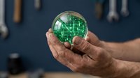 Mature male hand holding glowing green digital globe with circuit board pattern, representing global technology, innovation, and digital connectivity for business and corporate concepts.