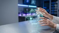 Hands of a woman in business attire interact with glowing digital globe hologram, representing global connectivity, data transfer, and modern technology solutions for corporate environments.