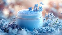 Blue cosmetic cream jar with delicate flowers and sparkling frost effect against blurred background, creating magical skincare atmosphere for beauty product photography.