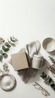 Neutral spa flatlay with candle, eucalyptus, ceramic bowls and natural elements on beige background for wellness branding and relaxation concepts.