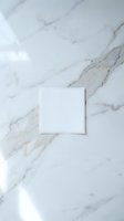 White square card mockup on elegant marble surface with natural veining patterns for branding and stationery design projects.