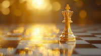 Golden chess king piece on chessboard with dramatic lighting and bokeh effect background creates atmosphere of strategy, leadership and success in business concept.