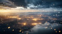 Aerial view of glowing city lights through dramatic clouds at dusk with magical floating light particles creating dreamy atmosphere. Suitable for background design.