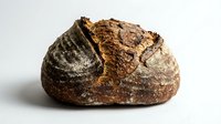 Artisan sourdough loaf with scored crust and flour dusting, isolated on white background for bakery, food, and culinary design projects.