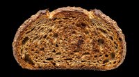 Whole wheat bread loaf half isolated on transparent background, ready for clipart, print-on-demand, t-shirt design, stickers, and sublimation projects.