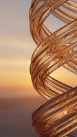 Abstract copper spiral sculpture with flowing twisted metal ribbons against warm golden sunset sky background for modern art and design projects.