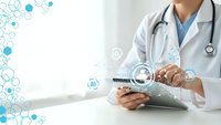 Healthcare professional using digital tablet with medical network icons and hexagonal molecular structure graphics for telemedicine consultation.
