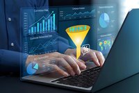 Business professional analyzing data conversion funnel with holographic dashboard charts and graphs on laptop for marketing analytics optimization.