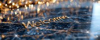 Golden welcome text on dark textured surface with sparkling bokeh lights and lens flares creating magical atmospheric mood for greeting backgrounds.