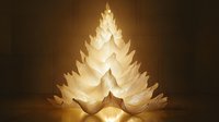 Glowing paper art Christmas tree made from layered white paper sheets creating magical festive atmosphere with warm light shining through translucent layers.