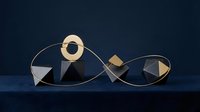 Geometric gold and black abstract shapes arranged in flowing composition against dark blue background for modern design projects.