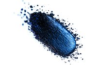 Crushed blue eyeshadow powder or cosmetic pigment scattered on white background, macro shot showing texture and shimmer of loose makeup powder.