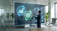 Professional businessman interacting with futuristic holographic display showing growth charts and target icons in modern glass office environment.
