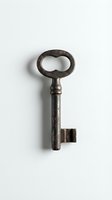 Antique iron skeleton key with oval bow and worn patina isolated on white background, suitable for historical, vintage, and design projects.