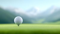 Golf ball on tee against blurred mountain landscape background with soft morning light and green fairway, macro sports photography perspective.
