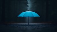 Glowing blue umbrella standing alone on dark ground against moody forest background creates mysterious atmospheric scene with dramatic lighting effect.