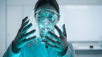 Woman in medical scrubs holding glowing digital hologram of human head, representing healthcare technology, artificial intelligence in medicine, and futuristic medical diagnostics.