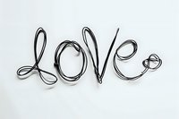 Creative wire typography forming the word love on white background, perfect for romantic designs, greeting cards and valentines day projects, isolated on white.