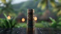 Decorative wooden tiki totem with tribal pattern carving on blurred tropical background with bokeh lights and palm leaves. Polynesian style ornament.