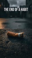 Discarded cigarette butt on asphalt street symbolizing smoking cessation and breaking bad habits for health awareness campaigns.