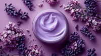 Luxurious purple cream with lavender flowers on pink background. Skincare cosmetic product for spa and beauty treatments.