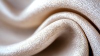 Soft beige linen fabric with gentle folds and natural texture creates elegant waves and curves, showing detailed weave pattern in macro photography. Suitable for textile design.