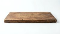 Rustic wooden cutting board with weathered surface and natural grain texture, isolated on white background for kitchen design and product mockups.