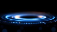 Glowing blue spiral light rings on black background create futuristic technology effect with bokeh particles and motion blur for abstract design concept.