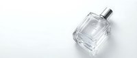 Luxury glass perfume bottle with silver cap on white background, elegant fragrance container for cosmetic and beauty product design.